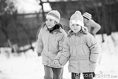 Small southern romanian village. Scenes from a moody winter with children playing with sledges and enjoying the snow Editorial Stock Photo