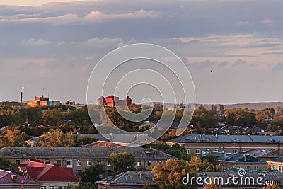 Small soviet city on sunset.The sun comes out from behind the clouds. Stock Photo