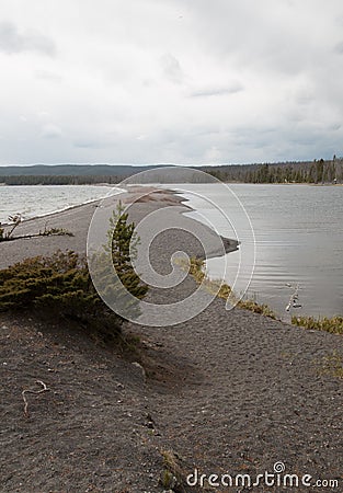 Small spit of sand called Hard Road to Follow on the banks of Yellowstone Lake in Yellowstone National Park in Wyoming USA Stock Photo