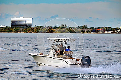 Small Sport Fishing Boat powered by a Single Outboard Engine Editorial Stock Photo