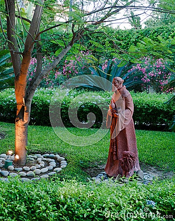 Small statue illuminated Stock Photo