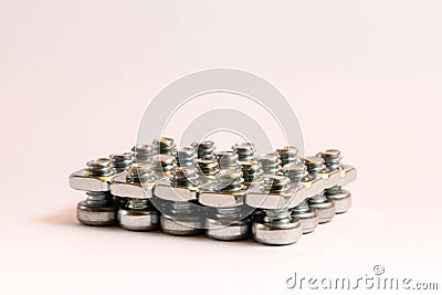 Small steel nuts and bolts in a group Stock Photo