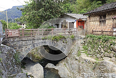 Small stone arch bridge in front of home, adobe rgb Editorial Stock Photo