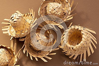 Small straw hats used for festa junina ornaments on brown background Stock Photo