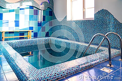 Small swimming pool with blue cold water at the bath complex Stock Photo