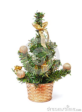 Small tiny artificial christmas tree with golden decorations Stock Photo