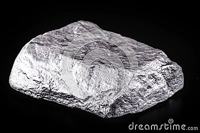 small titanium stone, metal used in light alloys. Macro photography of rough ore Stock Photo