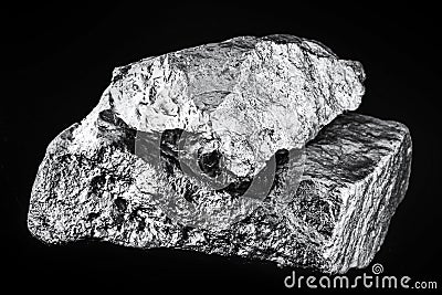 small titanium stone, metal used in light alloys. Macro photography of rough ore Stock Photo