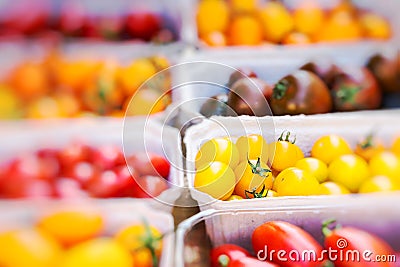 Small tomatoes on display at the farmers market Stock Photo