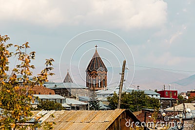 Small town Gyumri, Armenia. View for the dome of the church against the backdrop of the mountains Stock Photo