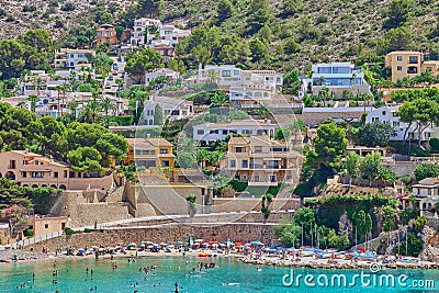 A small town on the mountainside and a beautiful sandy beach on the Mediterranean coast Editorial Stock Photo