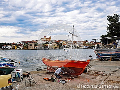 Repainting Wooden Greek Fishing Boat, Galaxidi, Greece Editorial Stock Photo