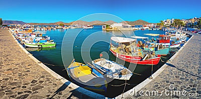 The small traditional harbor of Elounda at sunset, Crete Stock Photo