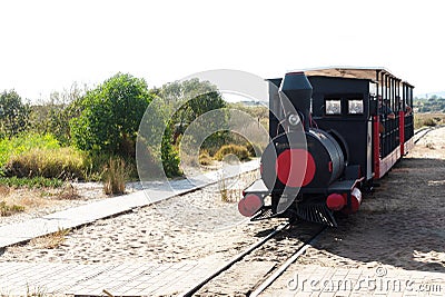 The small train connecting Santa luzia to the beach of Barril. Stock Photo