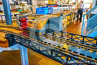 The small train runs on railroad tracks delivering customer`s orders, Vytopna restaurant, on March 12 in Prague, Czech Republic Editorial Stock Photo