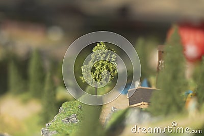 Small trees. Model of mountainous terrain and forests. Toy world Stock Photo