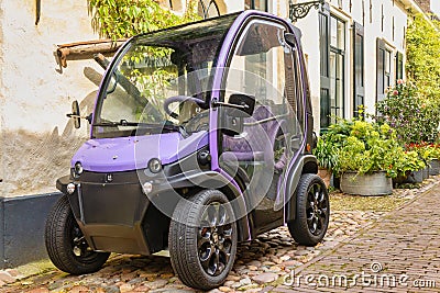 Small two person full electric mini car Biro parked in the Dutch city of Elburg, The Netherlands Editorial Stock Photo