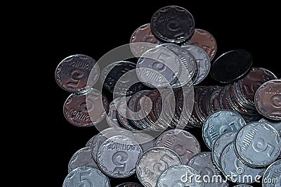 Small Ukrainian coins isolated on black background. Close-up Stock Photo