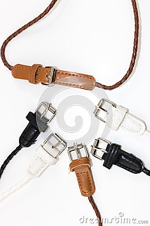 Small variety color fashion belt on white backdrop Stock Photo