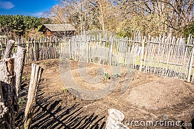 Small vegetable garden with risen beds in the fenced backyard Stock Photo