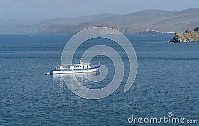 The small vessel on a large lake. Sunny day Stock Photo