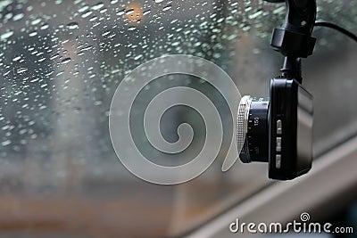 Small video camera record inside motor vehicle on windshield Stock Photo