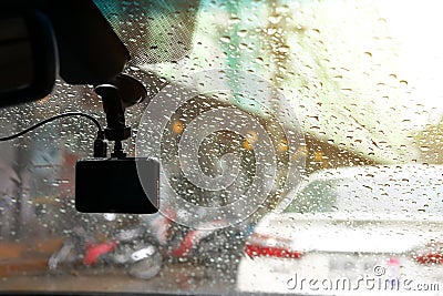 Small video camera record inside motor vehicle on windshield Stock Photo