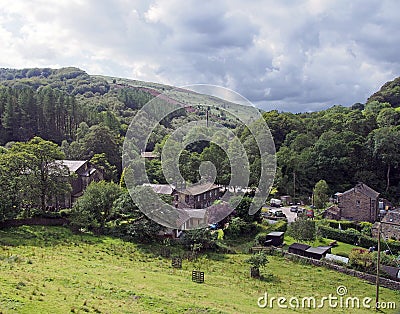 The village of cragg vale in west yorkshire surrounded by pennine hills and trees Stock Photo