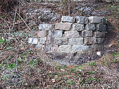 Small Wall Built Using Rectangular Stone Blocks Stock Photo