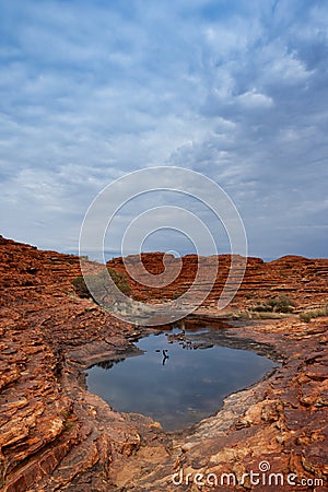 A small water spring located among the majestic Kings Canyon, Northern Territory, Australia Stock Photo