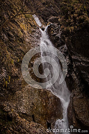 Fast flowing water over small rapids Stock Photo