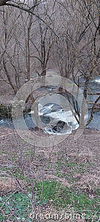 A small waterfall in the forest. A quiet and peaceful place for family holidays Stock Photo