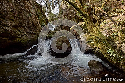 Small waterfall formed by the river Teo in the area of Galicia, Spain Stock Photo