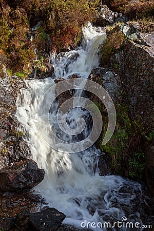 Small waterfall by Loch Laggan in Scotland Stock Photo