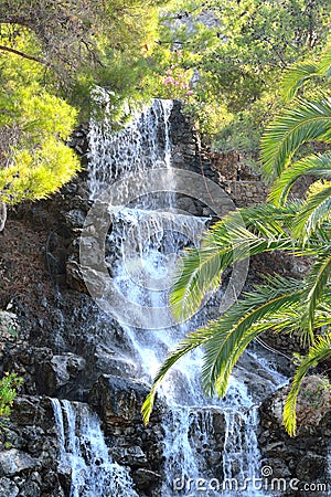 Small waterfall in the park in Loutraki. Stock Photo