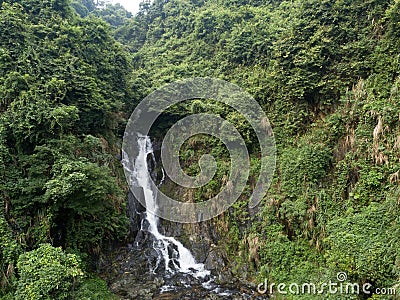 Small Waterfall in the Tropical Rainforest Mountains Stock Photo