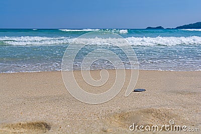 Small wave coast with sandy beach and clean sky Stock Photo