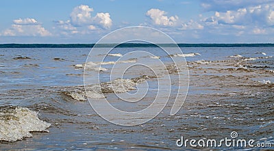 Small waves lapping on the shore Stock Photo