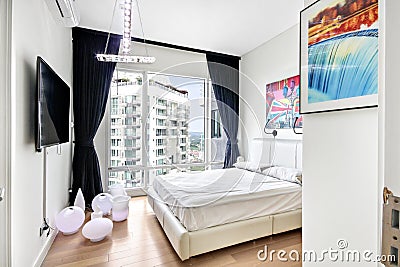 Small white bedroom Editorial Stock Photo