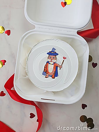 Small white bento cake with a drawnwizard tiger as a gift for the holiday Stock Photo