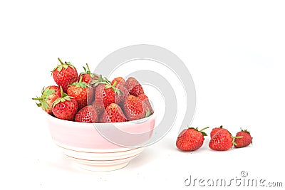 Small white bowl filled with red strawberries Stock Photo