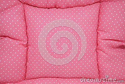 Small white polka dots on pink background fabric Stock Photo