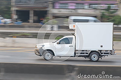 Small white trucks for refrigerators, fast road transport Stock Photo