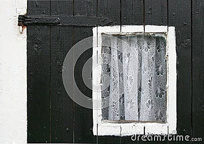 Small window with curtains Stock Photo