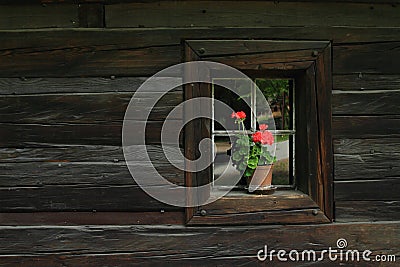 Small window in timbered house with flower Stock Photo