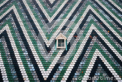 Small window on on wall painted zigzag. Vienna, Austria. Stock Photo