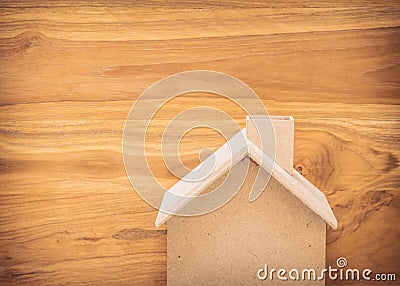 Small wood house model on brown background Stock Photo