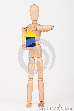 Small wood mannequin holding colourful blocks Stock Photo