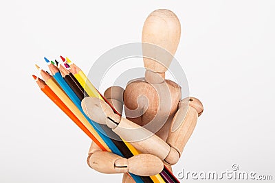 Small wood mannequin standing with pencils Stock Photo