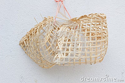 Small wooden birdcages on the white wall Stock Photo